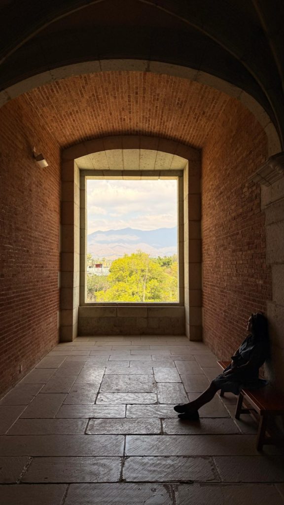 View of the Oaxaca landscape through a large historic stone window